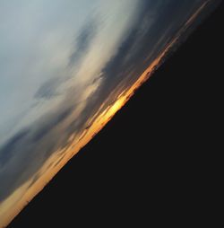 Low angle view of dramatic sky during sunset