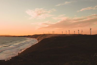 Scenic view of beach against sky during sunset