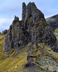 Low angle view of rock formations against sky