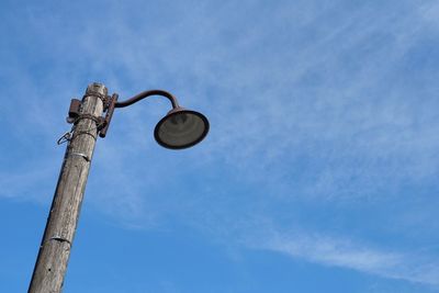 Low angle view of street light against sky