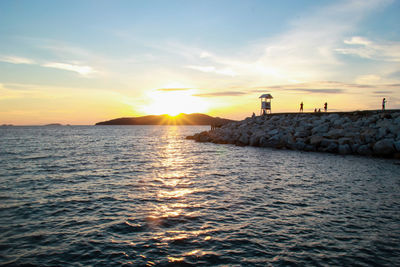 Scenic view of sea against sky during sunset