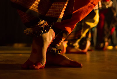 Low section of woman dancing on stage