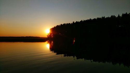 Scenic view of sunset over lake