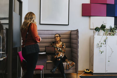 Female coworkers talking together