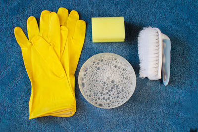 High angle view of yellow painted on table