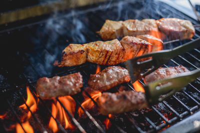 Close-up of meat on barbecue grill