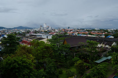 High angle view of buildings in town against sky