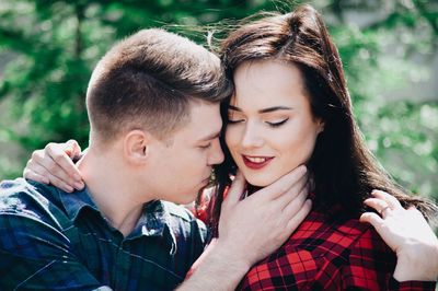 Loving young couple in forest