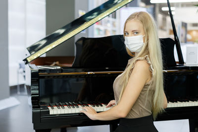 Teenage girl playing piano