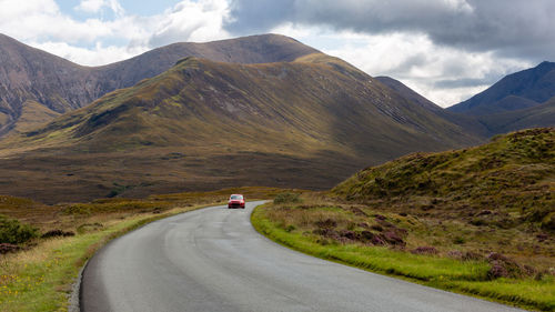 Scenic view of mountain road against sky