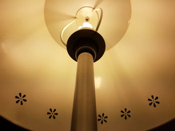 Low angle view of illuminated lamp against sky