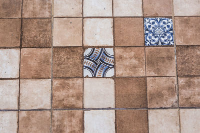 High angle view of flag on tiled floor