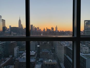 Sunrise view of new york city through industrial window front