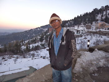 Man standing on snow covered mountain