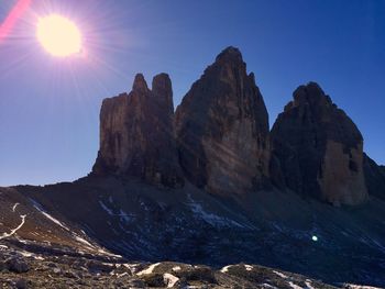 Scenic view of mountains against clear blue sky