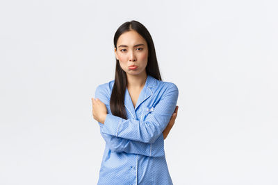 Portrait of a beautiful young woman over white background