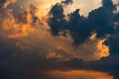 Low angle view of dramatic sky during sunset