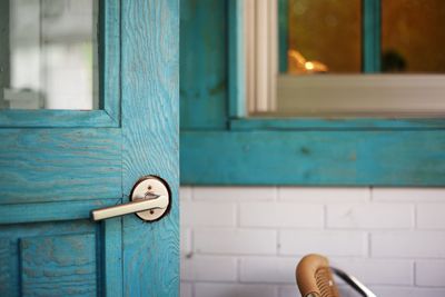 Close-up of turquoise wooden door