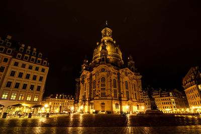 Illuminated cathedral against sky at night