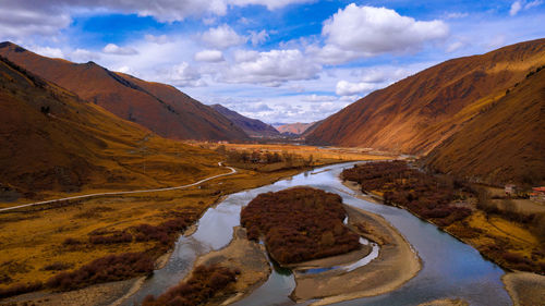 Panoramic view of lake and mountains against sky