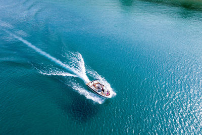 An aerial view of a group of friends power boating on lake tahoe, ca