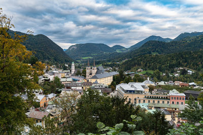 High angle view of townscape and mountains against sky