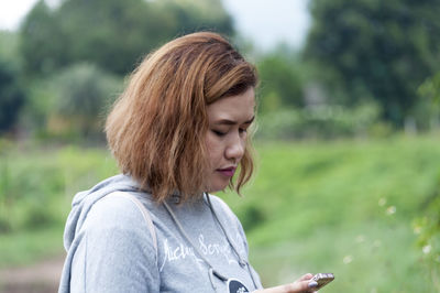 Portrait of smiling woman in park