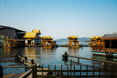 View of canal and buildings against clear sky