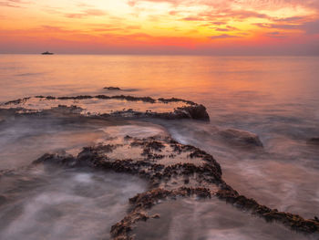 Scenic view of sea against sky during sunset