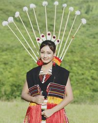 Portrait of a smiling young woman standing outdoors