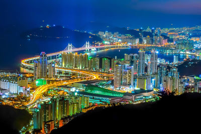 Illuminated modern buildings in city at night