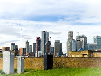 Buildings in city against sky