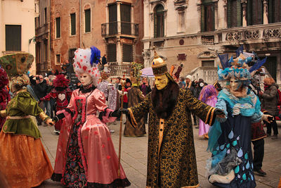 Venice carnival, italy. people in traditional venetian masks.
