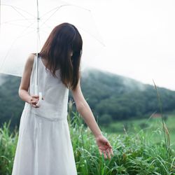 Woman standing on field