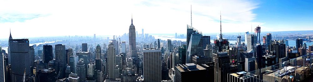 Modern buildings in city against sky