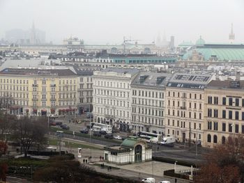 High angle view of buildings in city against sky