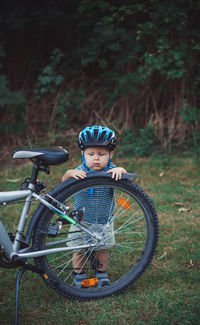 Portrait of boy riding bicycle