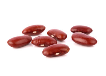 High angle view of coffee beans against white background