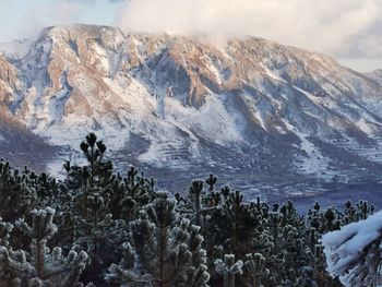 Scenic view of snowcapped mountains against sky