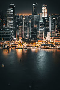 Illuminated buildings in city at night