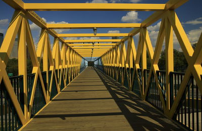 View of footbridge against sky