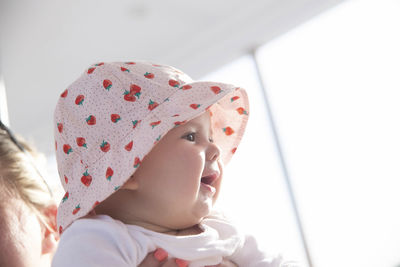 Close-up of cute girl looking away