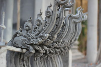 Close-up of statue against building