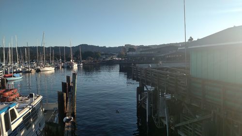 Boats moored at harbor