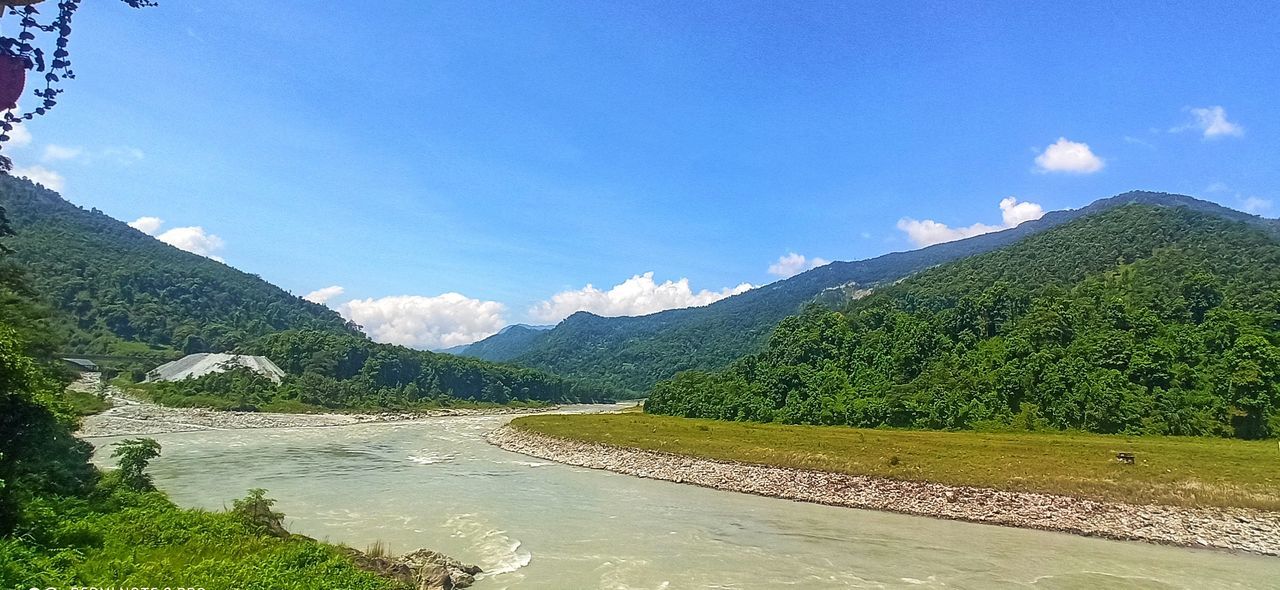 mountain, scenics - nature, beauty in nature, sky, environment, landscape, plant, nature, mountain range, water, tree, land, valley, tranquility, cloud, tranquil scene, green, lake, no people, travel, non-urban scene, blue, day, travel destinations, forest, idyllic, outdoors, tourism, sunlight, reservoir, pinaceae, mountain pass, grass, pine tree, highland, plateau, coniferous tree, rural scene