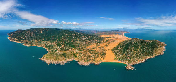 Aerial view sea with land against sky