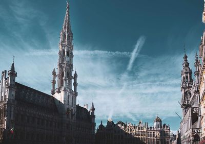 Panoramic view of buildings in city against sky