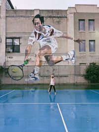 Woman playing tennis in a urban court