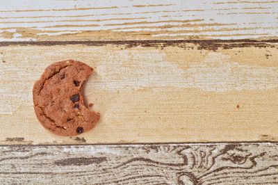 Close-up of peeled bread on wooden table