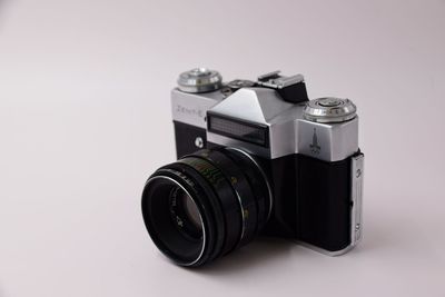 Close-up of camera against white background